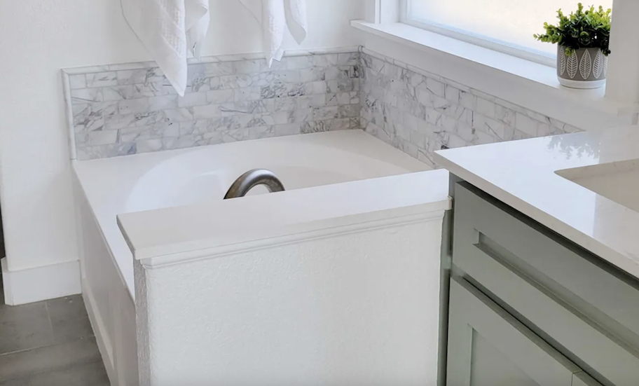 full bathroom with soaking tub