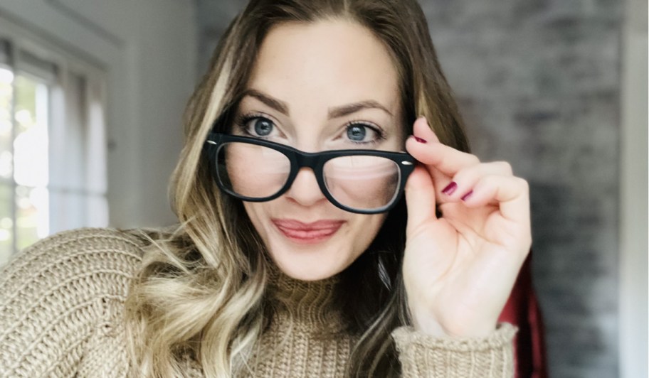 woman holding glasses