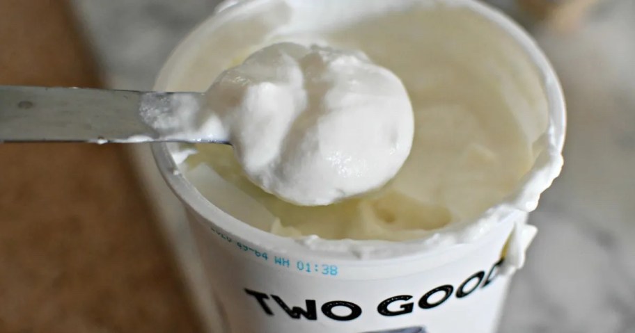 silver spoon scooping greek yogurt