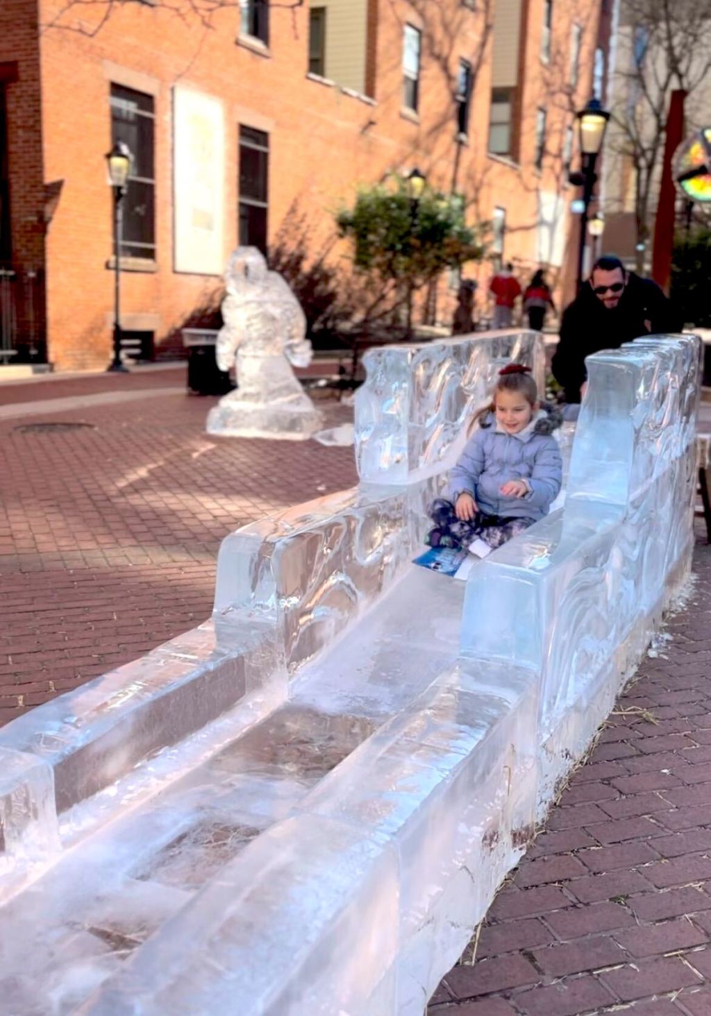 girl going down ice slide 