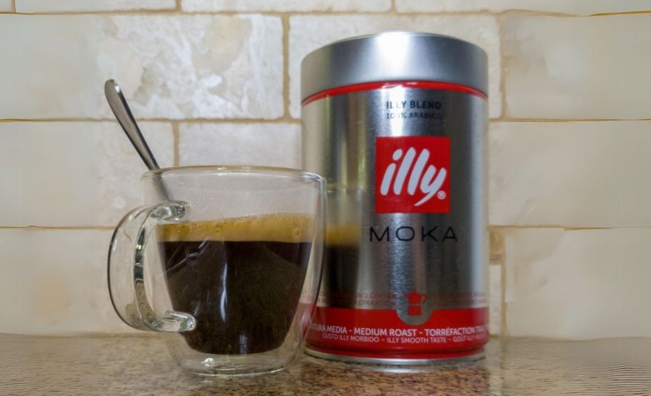 a can of illy moka ground coffee shown with a cup of coffee 