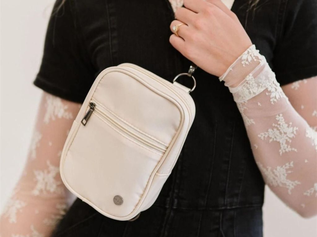 person wearing white belt bag