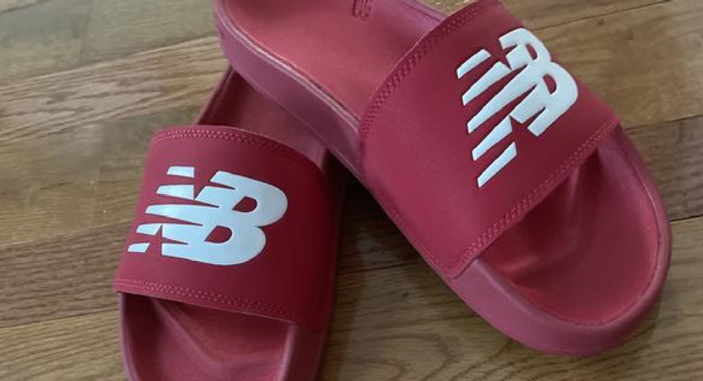 new balance red slides on the floor