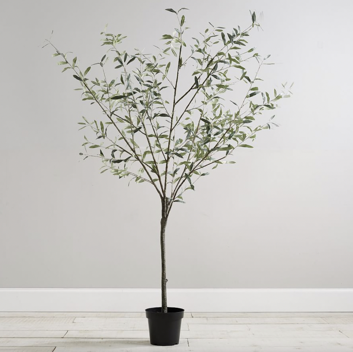 faux olive tree in black planter 