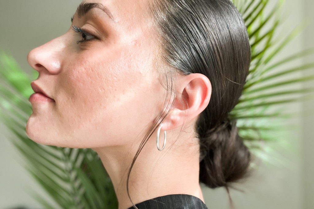 woman wearing silver hoop earrings