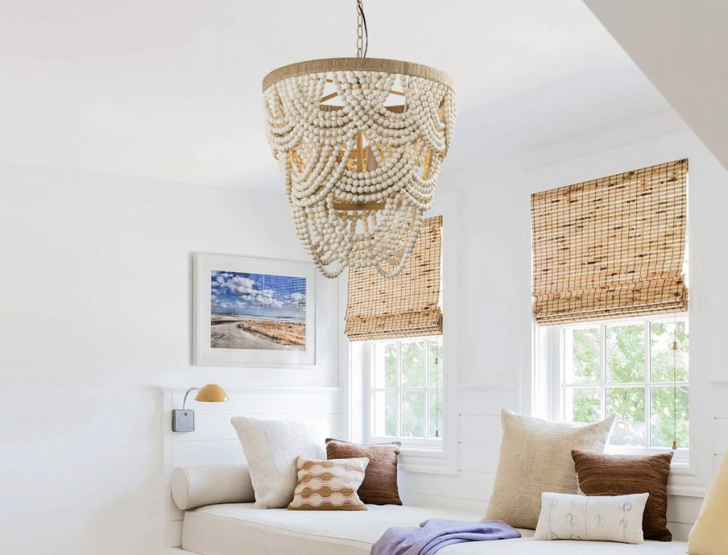 wood bead garland chandelier hanging from ceiling in nook space