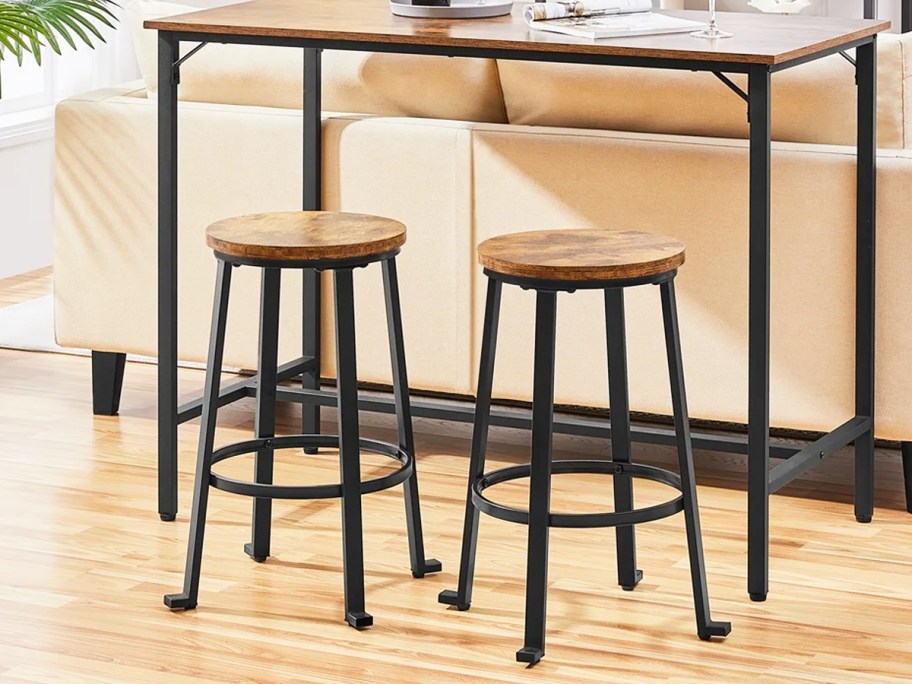 brown and black backless barstools at table