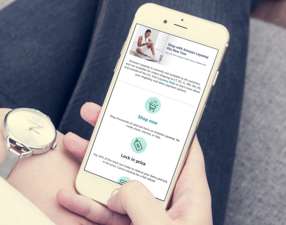 Woman showing Amazon Layaway Webpage on iphone