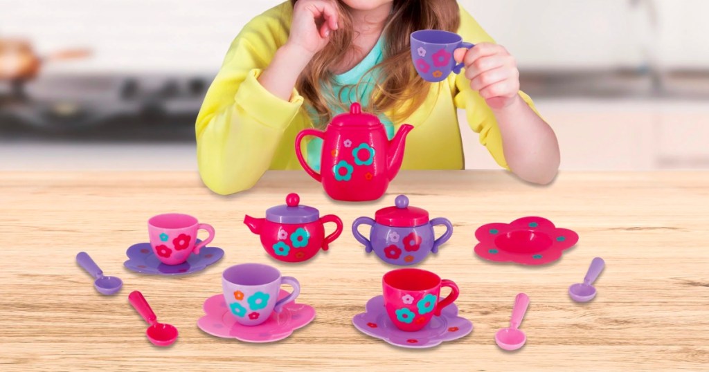 girl playing with Kid Connection 18-Piece Tea Play Set