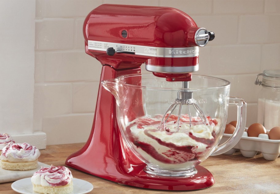 red kitchenaid mixer with glass bowl on kitchen counter