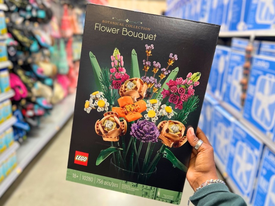 hand holding up LEGO Icons Flower Bouquet box in store