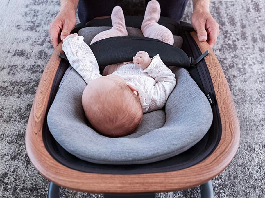 A Baby using the Maxi-Cosi Kori 2-in-1 Baby Rocker as it is one of the onlinepany that has teacher discounts for 2024