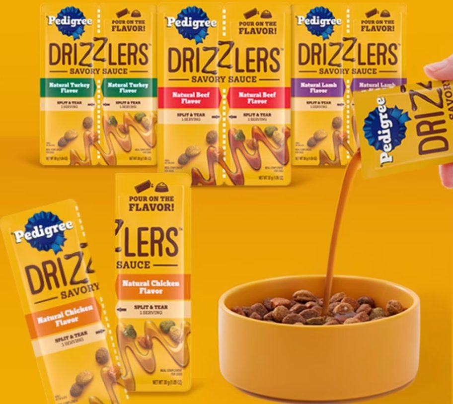 Hand pouring a pouch of Pedigree Drizzlers onto a bowl of dry dog food with 4 packs of different flavors in the background