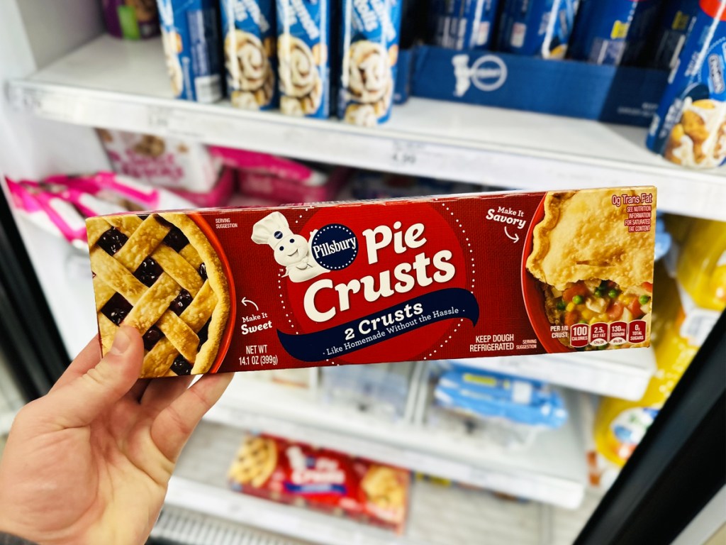 hand holding Pillsbury Ready-to-Bake Pie Crust box