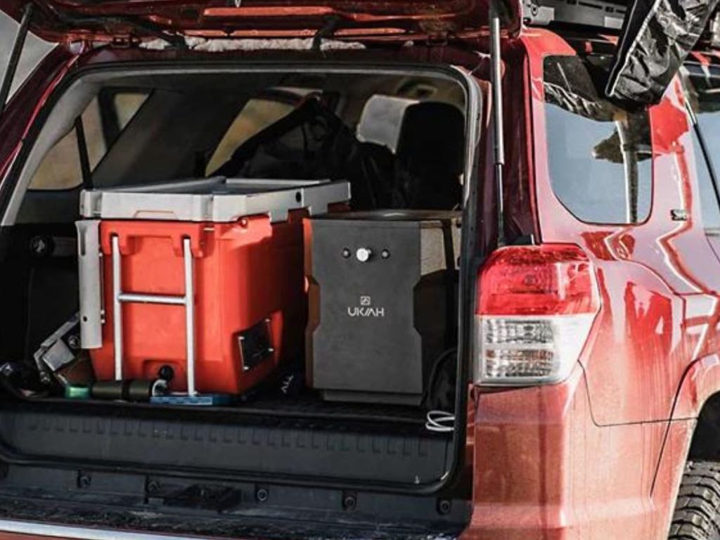 back of car trunk opened revealing cooler and Ukiah firepit speaker