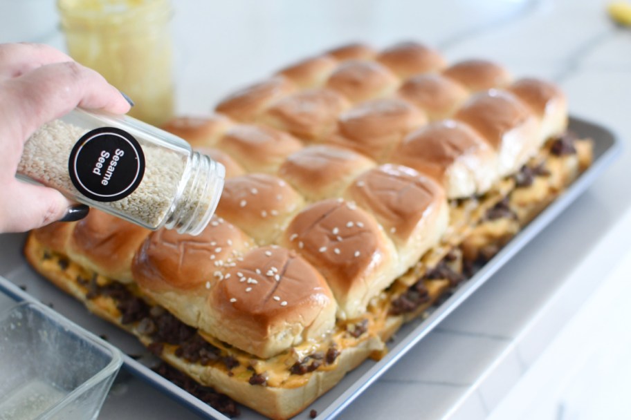 Adding sesame seeds to the top of sliders