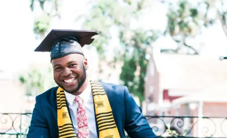 man dressed in graduation attire