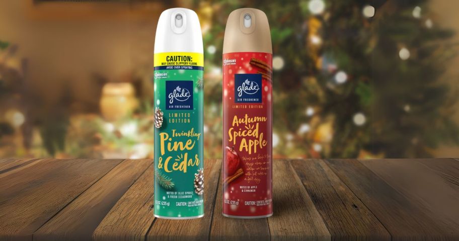 two glade air freshener bottles on table