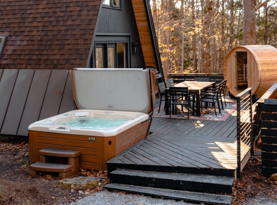 open hot tub outside of a frame house