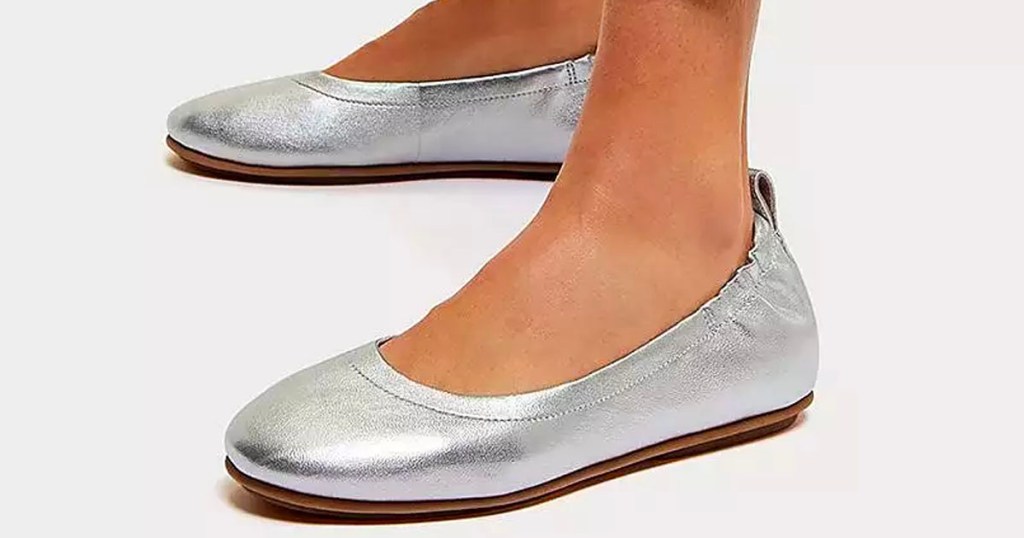 woman wearing silver ballet flats