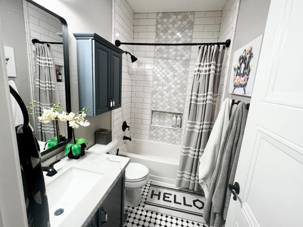 full bathroom with shower tub and single vanity