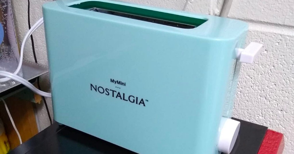 teal nostalgia mini toaster on table