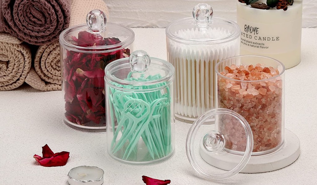 bathroom jars filled with q tips and floss