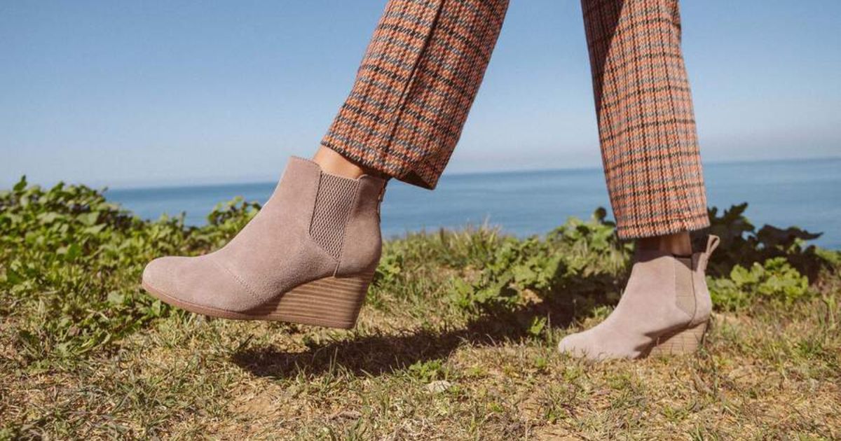 woman wearing tan ankle boots