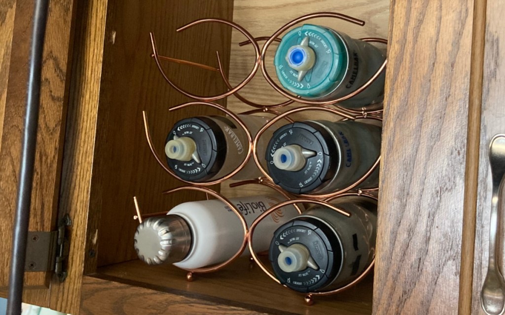 water bottles in cabinet