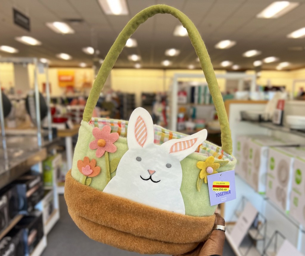 holding up felt easter basket in store