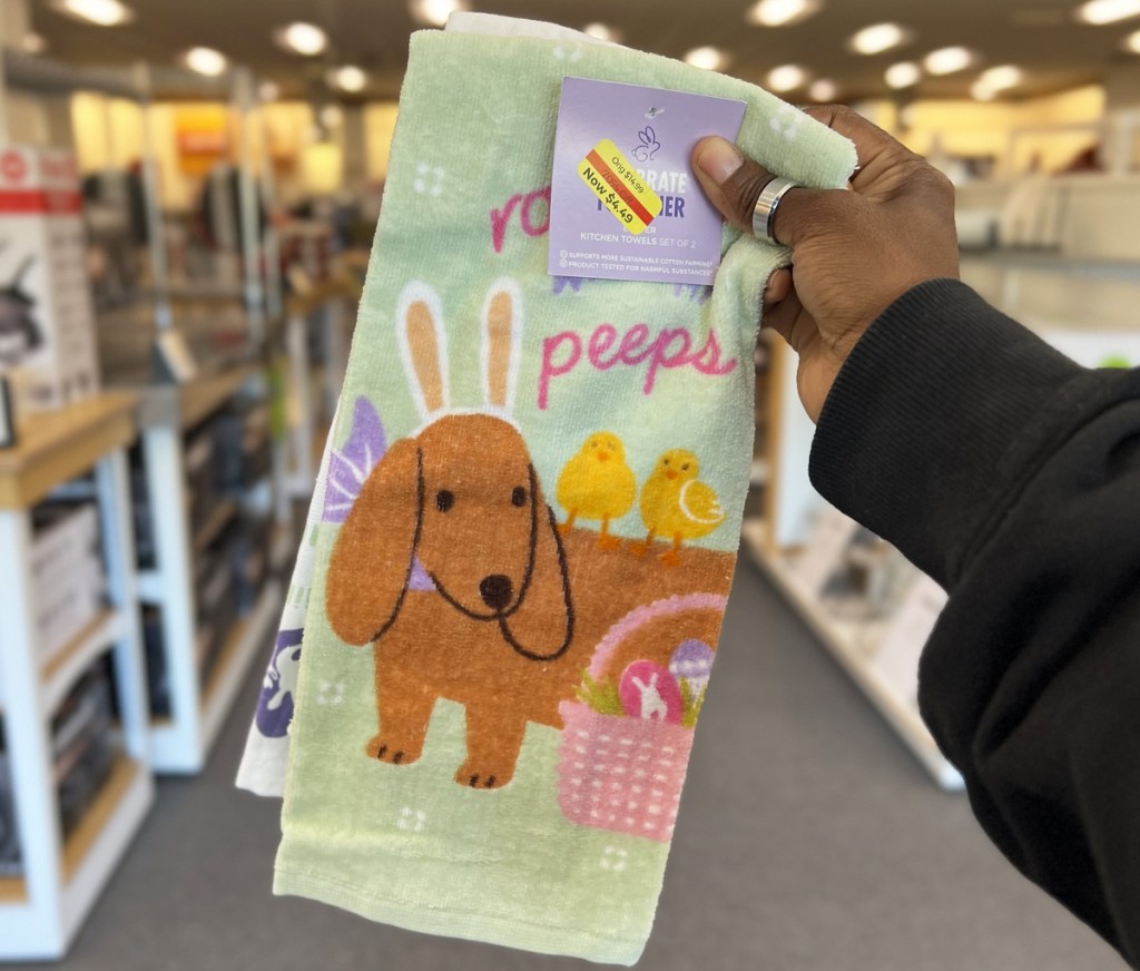 hand holding up easter dog kitchen towels