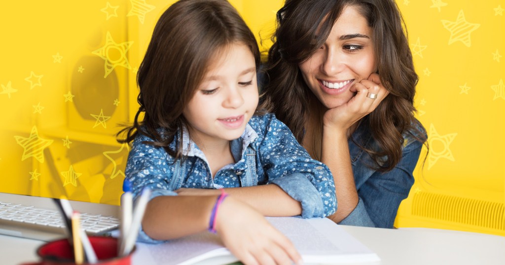 woman looking at girl reading from book