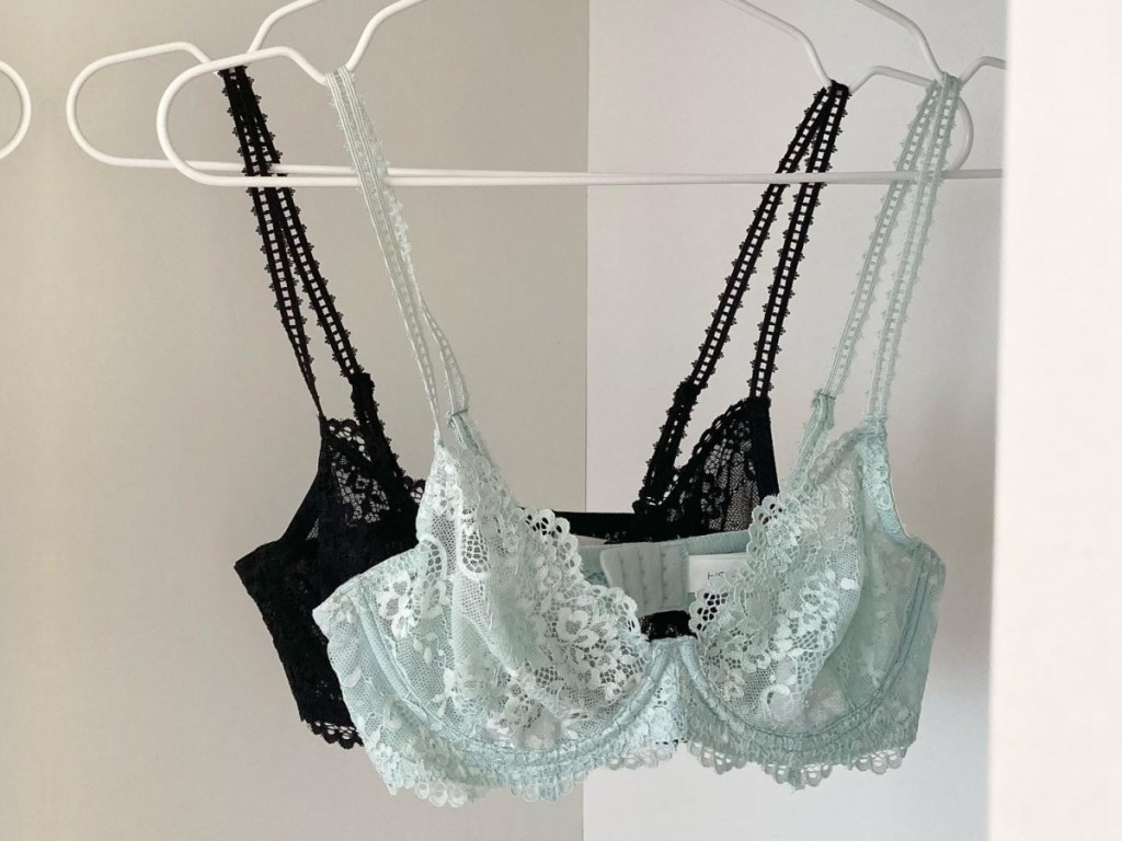 two black and blue bras on hanger