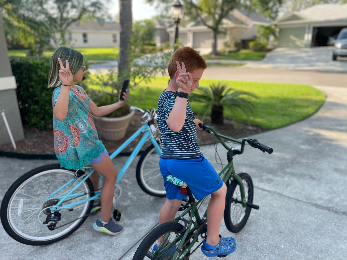 Kids using a Gabb watch and a Gabb phone