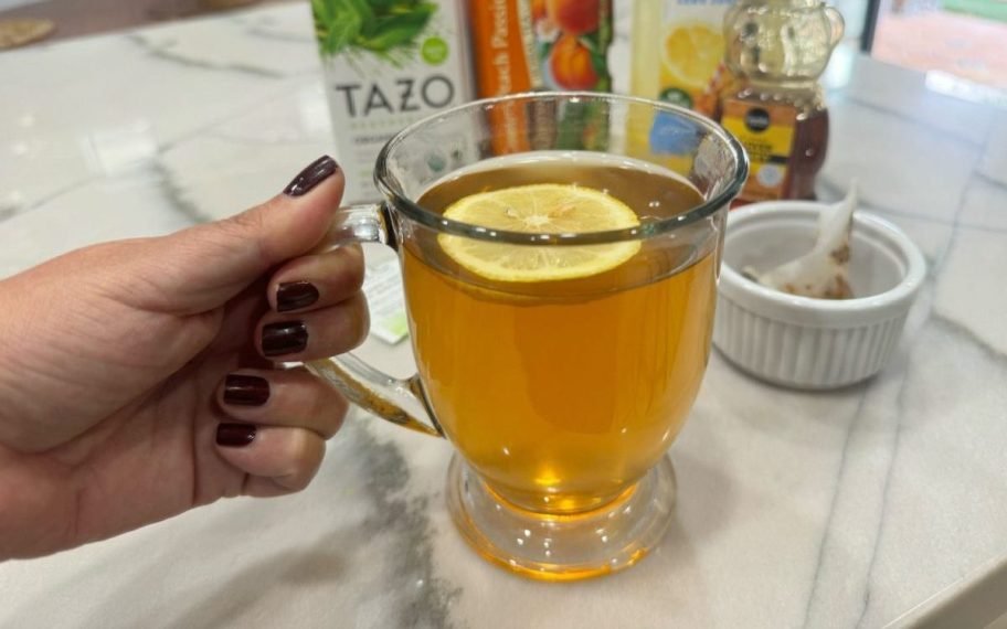 hand holding a cup of Medicine Ball Tea