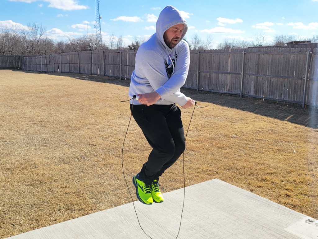 man jumping rope outside