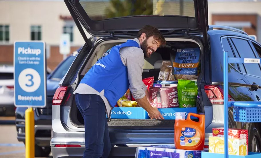 sams club employee loading items into back of car