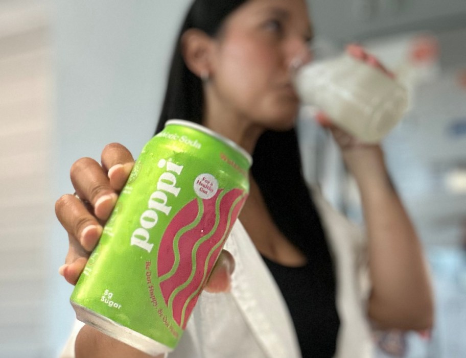 Woman Drinking a cherry limeade Poppi Soda