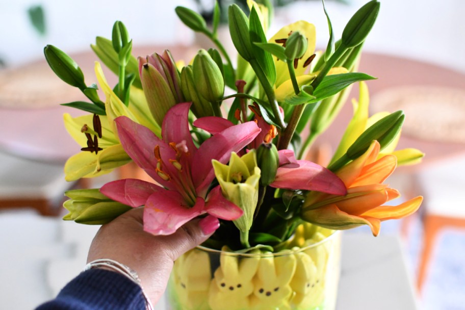 adding fresh flowers to peeps centerpiece