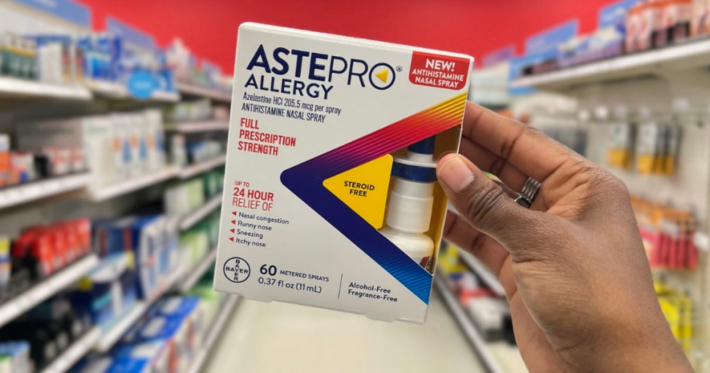 hand holding astepro nasal spray box