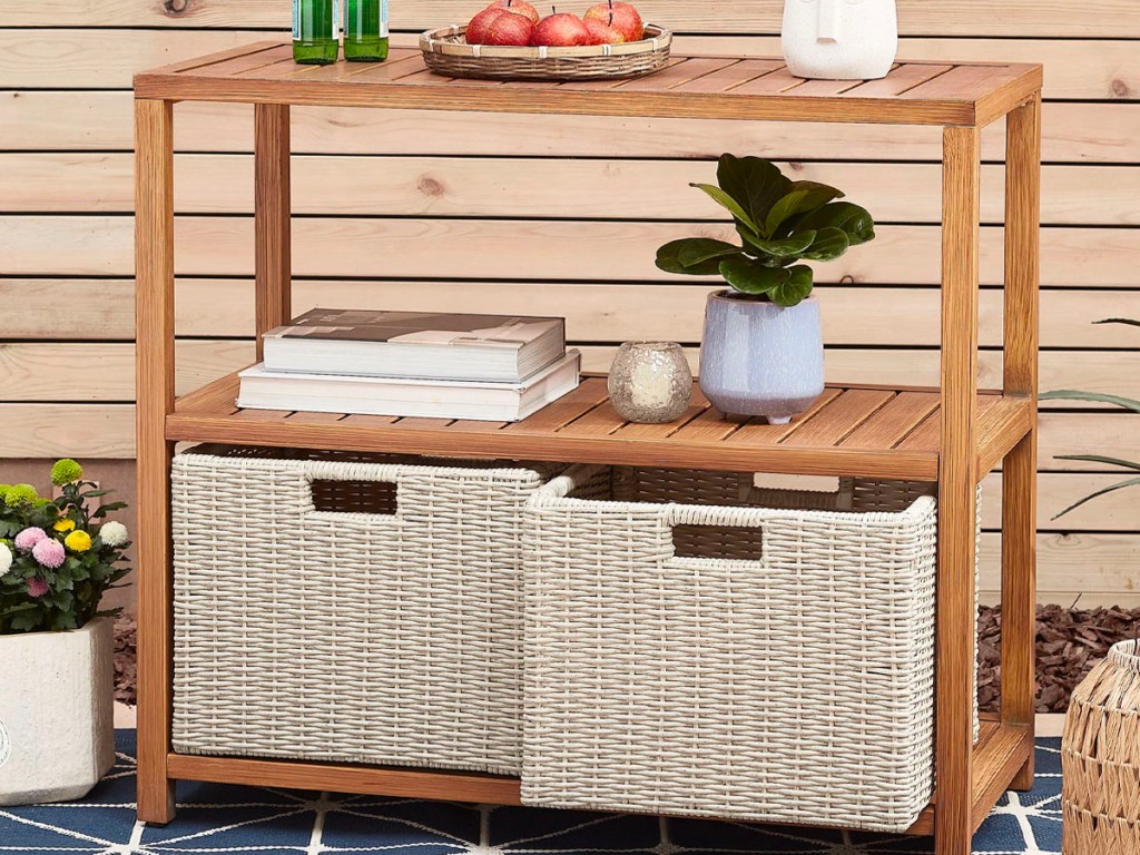 wooden outdoor console table with white wicker baskets 