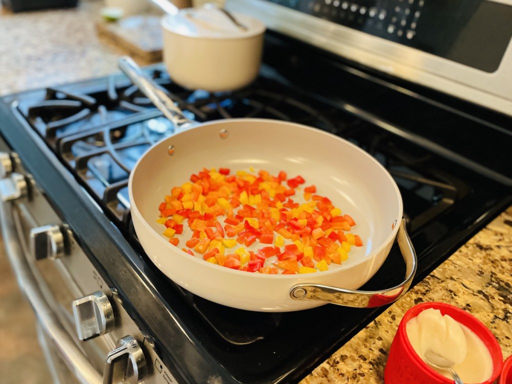 caraway pan on the stove with peppers and butter