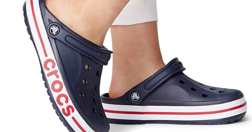 navy crocs bayabands on mans feet