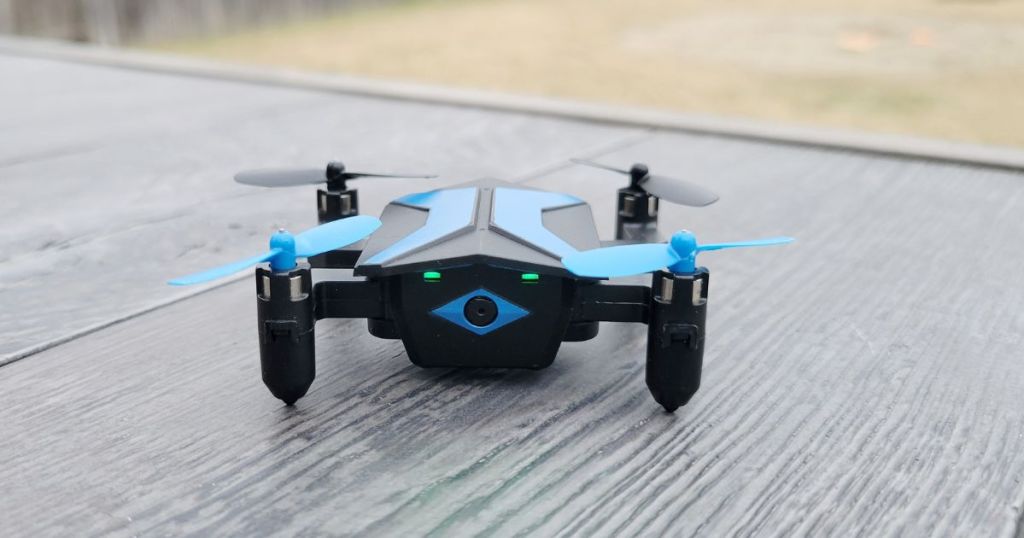 blue mini drone on table outdoors