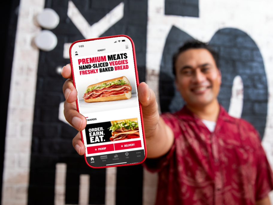 man showing Jimmy John's app on phone