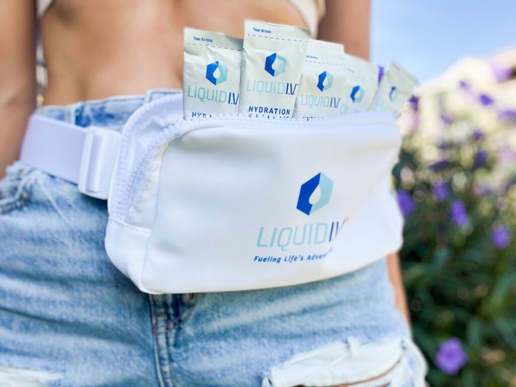 close up of liquid iv belt bag with drink packets inside