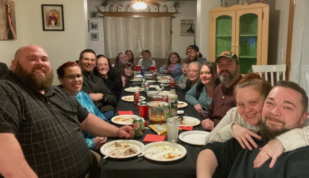 family surrounding dinner table