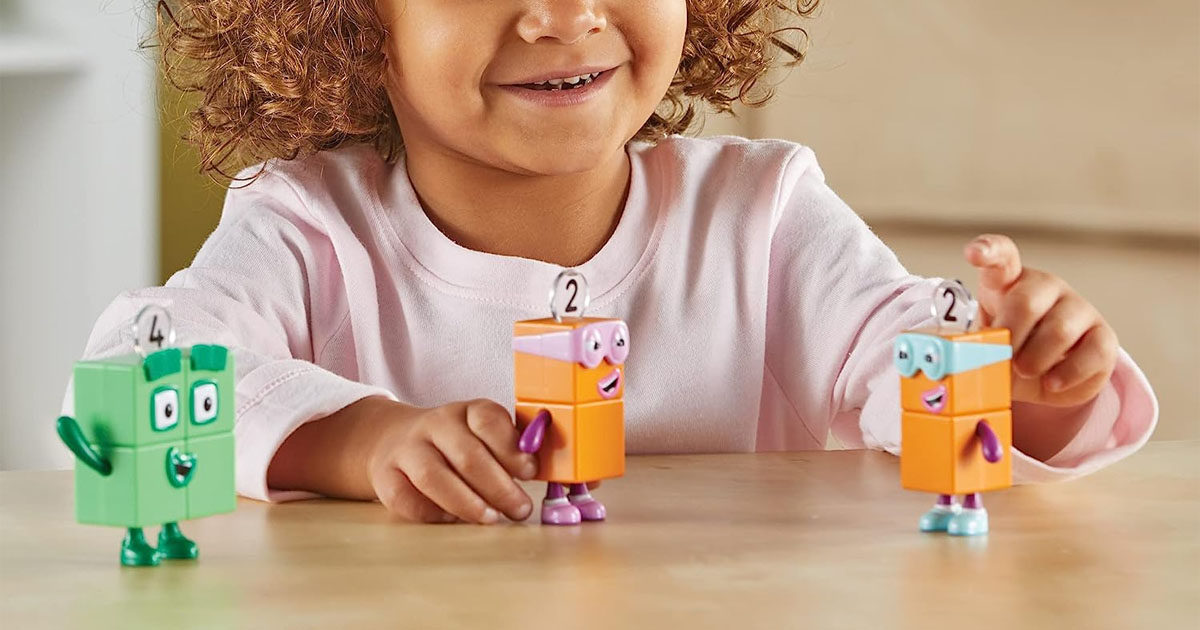 child playing with numberblocks figurines