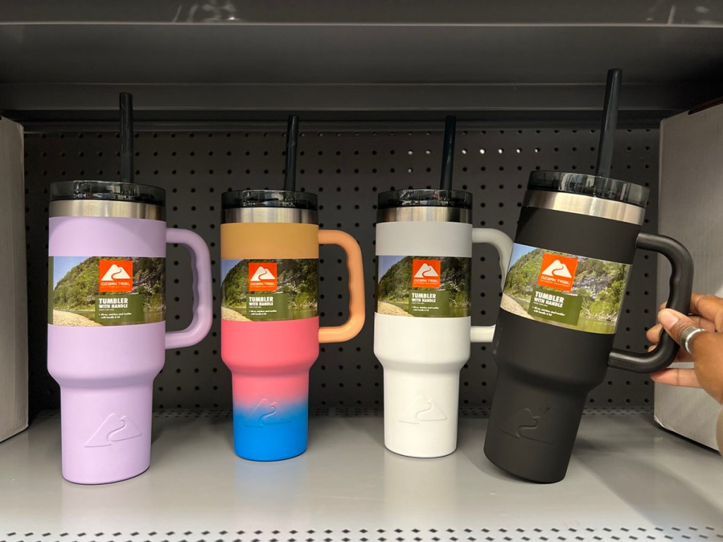 purple, ombre, white and black ozark trail tumblers on shelf