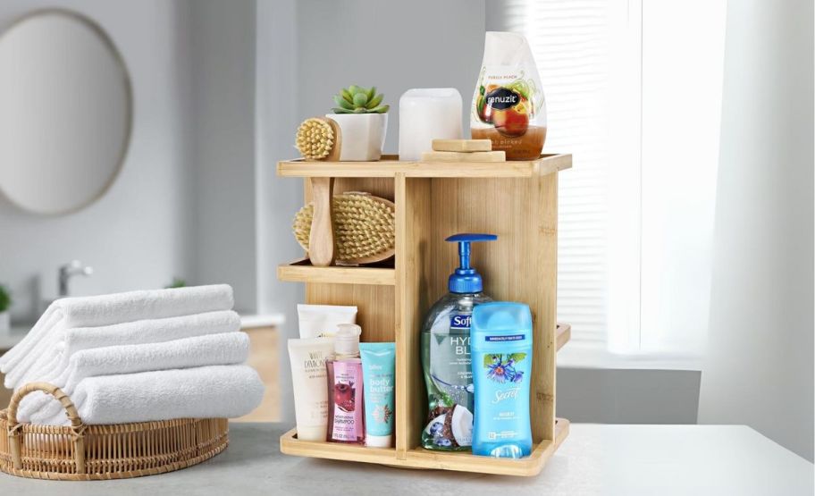 rotating bamboo makeup organizer on a bathroom counter